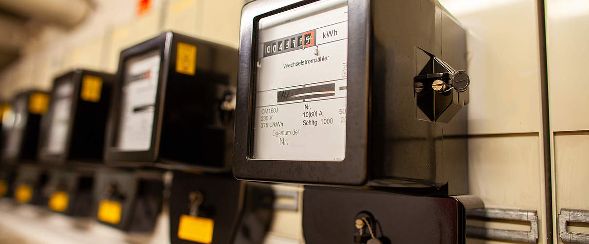 A lot of electric meter hangs in basement of a house