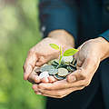 Business man with coins in hand